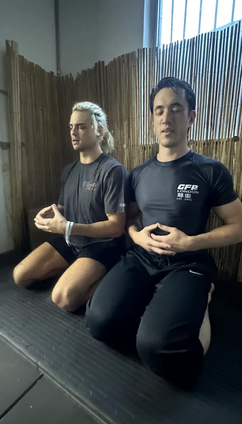 Harrison Saito training karate in a white gi