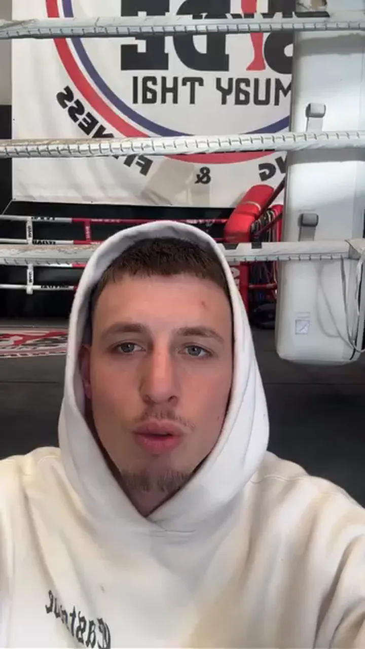 A client at his gym, filming his testimony on his phone