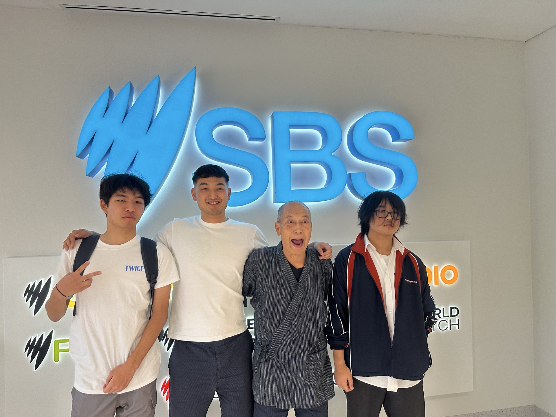 Harrison with students and father at SBS Radio