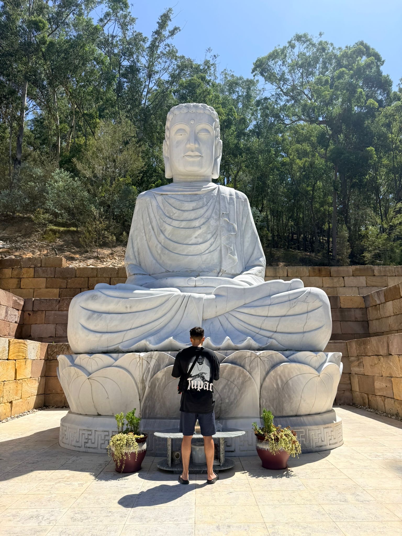 Harrison at Buddha statue
