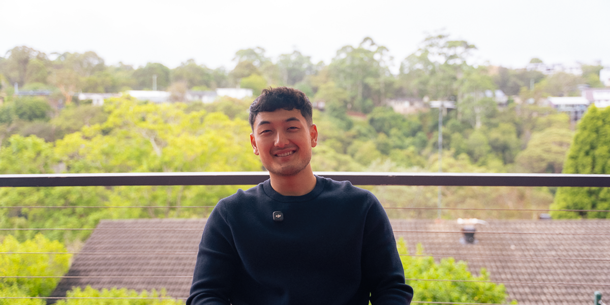Harrison smiling with green valley background